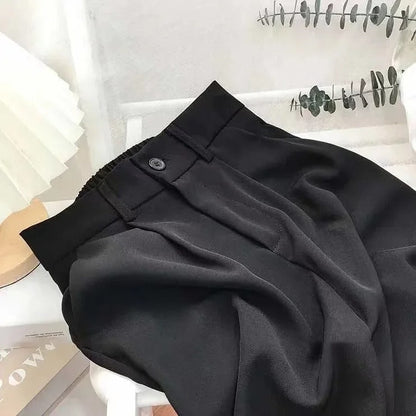 Elasticated women's high-waisted trousers