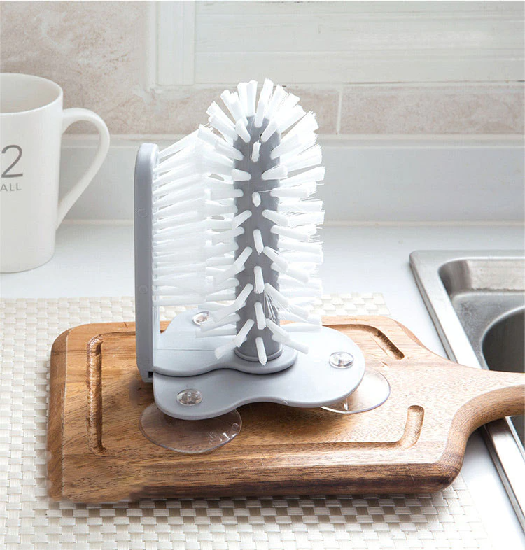 Glass cleaner with double-sided brush