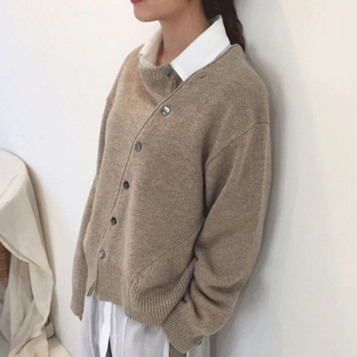 Ladies cardigan with asymmetric buttons