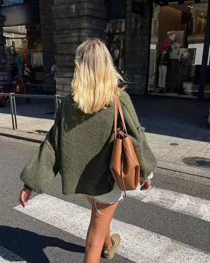 Oversized knitted jumper for women with stand-up collar