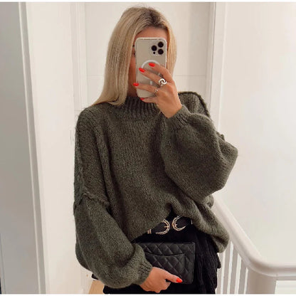Oversized knitted jumper for women with stand-up collar