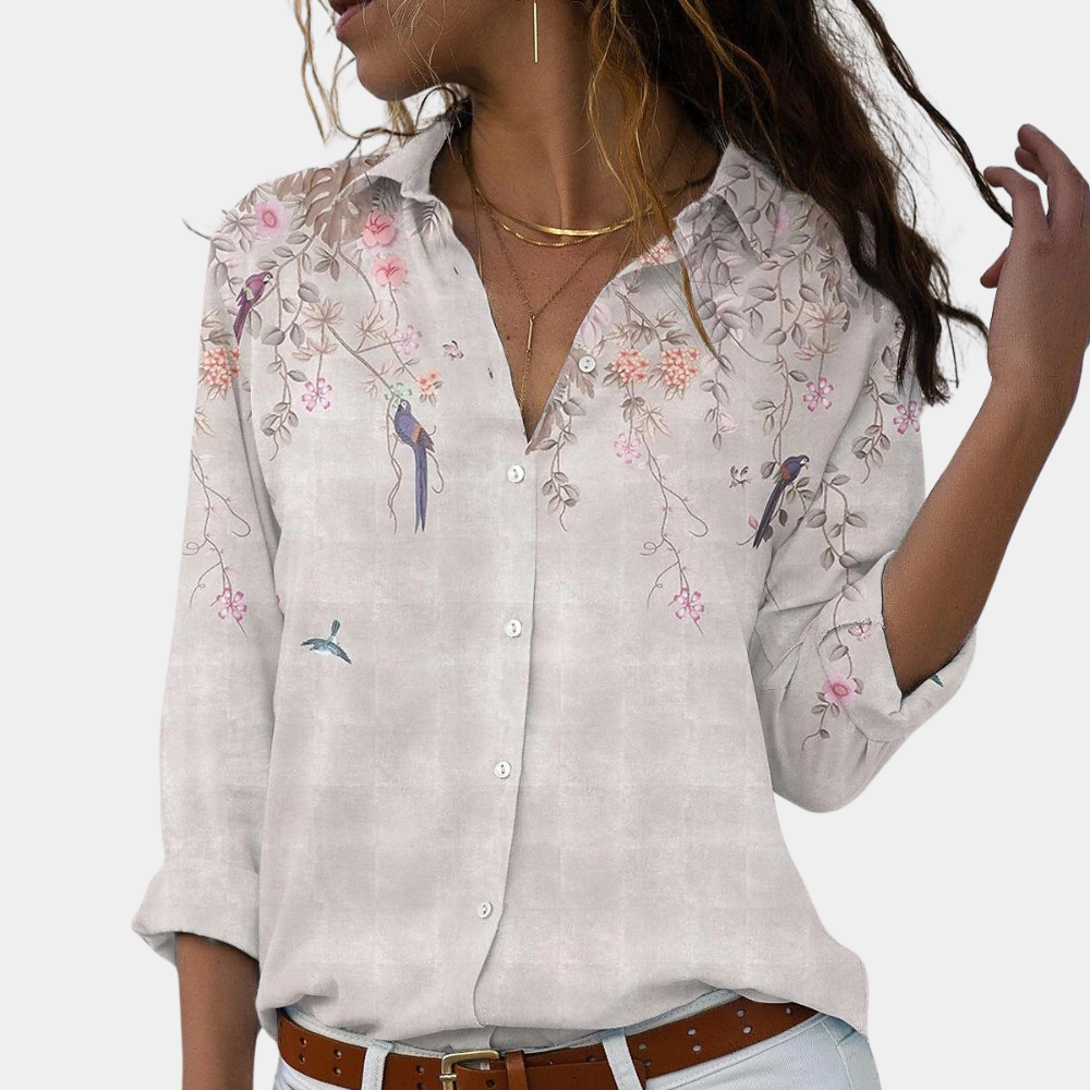 Women's blouse with floral embroidery and puff sleeves