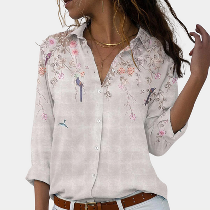 Women's blouse with floral embroidery and puff sleeves