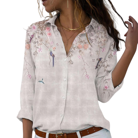 Women's blouse with floral embroidery and puff sleeves